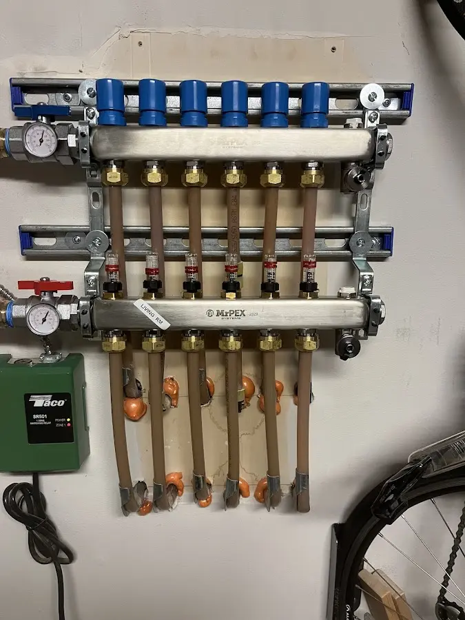 Plumber performing Water Heater Repair at a residential property in Coeur d'Alene